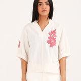 GRAPHIC TOP WITH PLEAT DETAIL