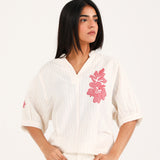 GRAPHIC TOP WITH PLEAT DETAIL