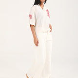 GRAPHIC TOP WITH PLEAT DETAIL
