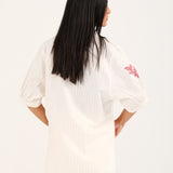 GRAPHIC TOP WITH PLEAT DETAIL