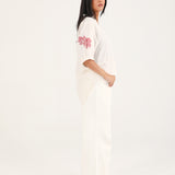 GRAPHIC TOP WITH PLEAT DETAIL