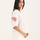GRAPHIC TOP WITH PLEAT DETAIL